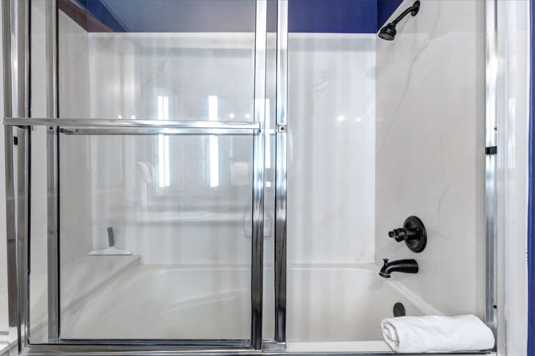Dual bathing options let you choose your morning routine—refresh quickly in the walk-in shower or unwind slowly in the full tub with overhead shower combo.