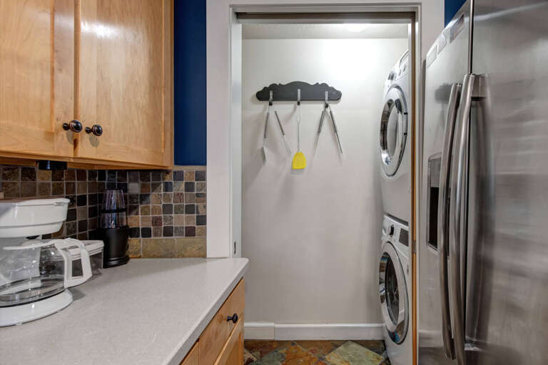 Crestview Commons A207: The laundry room is located next to the kitchen for convenience.