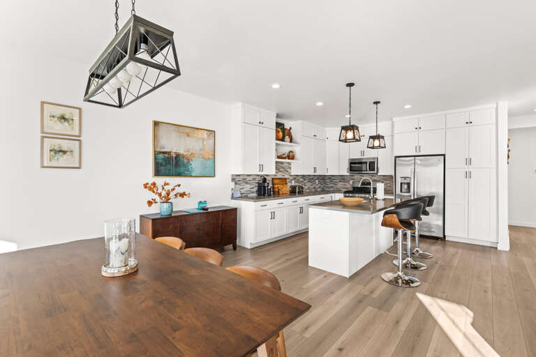 Jordanelle Ridge 499: Sideboard, dining table with seating for 8, and bar with seating for 3.