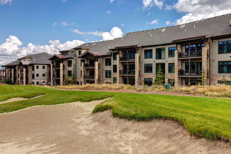 Mountain-style architecture meets manicured greens—this golf course-front property offers scenic fairway views and outdoor recreation steps from your door.