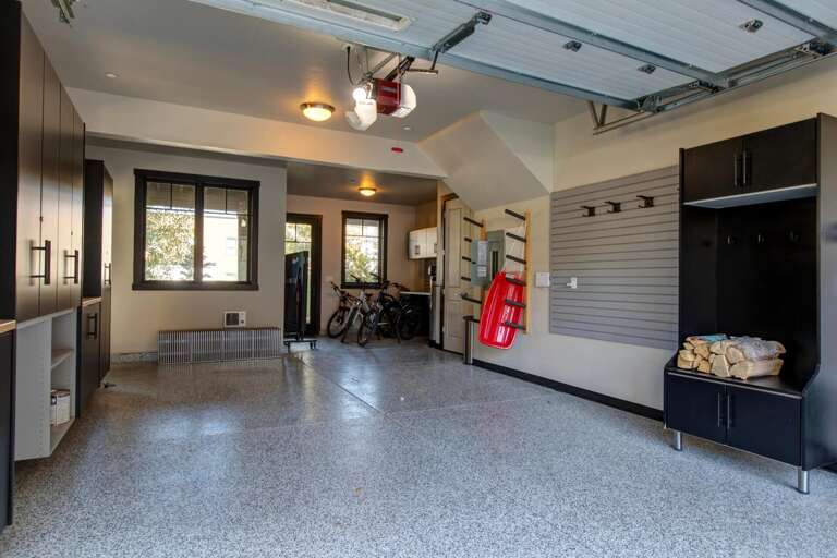 A well-organized garage provides ample space for your bikes and gear, with custom storage solutions keeping everything tidy and within easy reach.