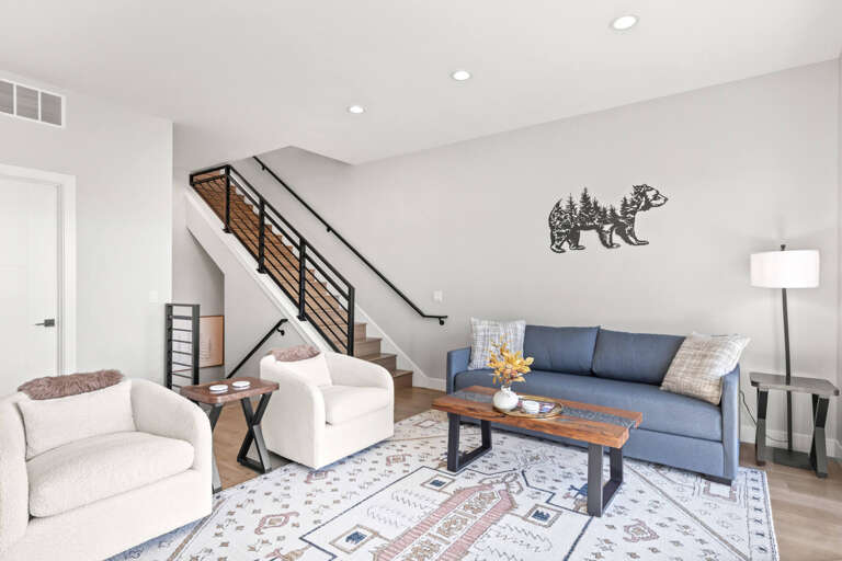 Settle into your inviting living space, where modern mountain charm meets comfort. Sink into plush seating, unwind beneath thoughtful decor, and let the open layout welcome you home.