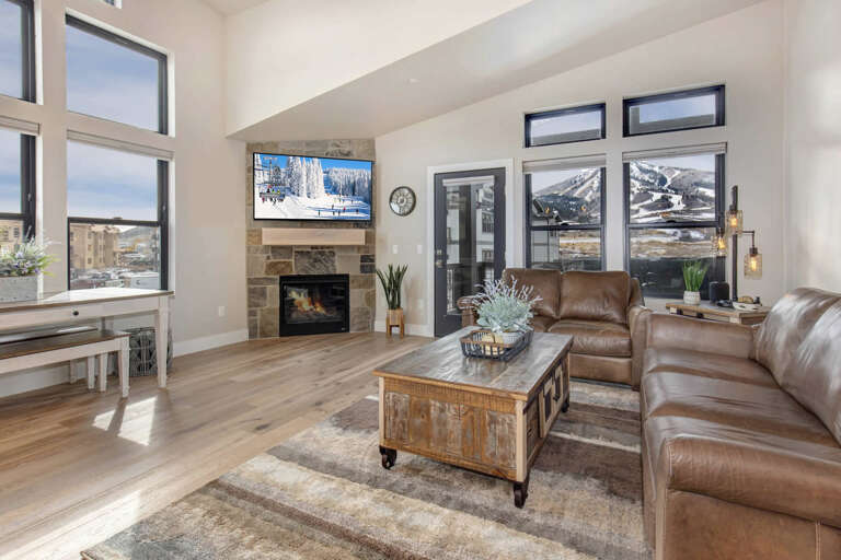 Mayflower Lakeside 1114-303: The great room is a wide-open space that allows for easy socializing with a corner fireplace with stone detail, and a large Smart HDTV. Mayflower Lakeside 1114-303: The great room is a wide-open space that allows for easy socializing with a corner fireplace with stone detail, and a large Smart HDTV.