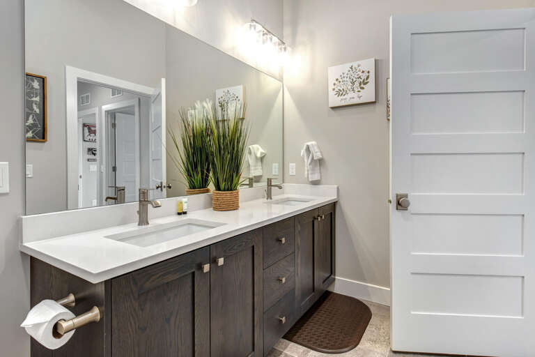 Mayflower Lakeside 1114-303: Guest full bathroom with a double vanity.