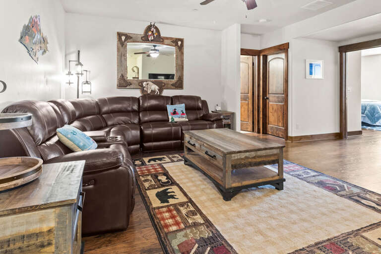 Sink into plush leather seating where you can unwind with loved ones in this spacious, elegantly appointed living area.