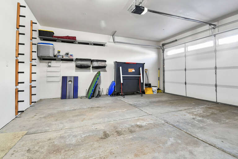 Spacious garage with organized storage, beach gear, and plenty of room for your vehicle and equipment during your stay.