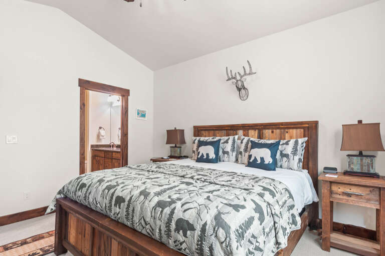 Drift off in your cozy retreat with rustic charm and wildlife-themed bedding that brings nature indoors for peaceful mountain dreams.