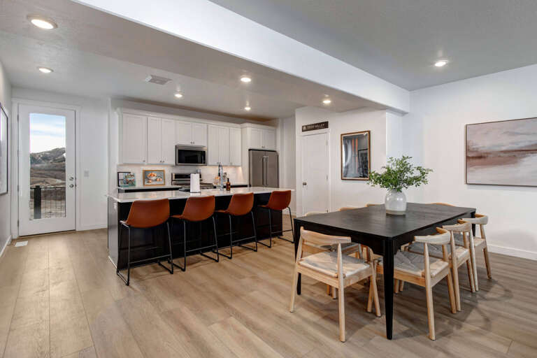 Your modern kitchen flows seamlessly into dining space, perfect for gathering with loved ones over home-cooked meals and morning coffee.