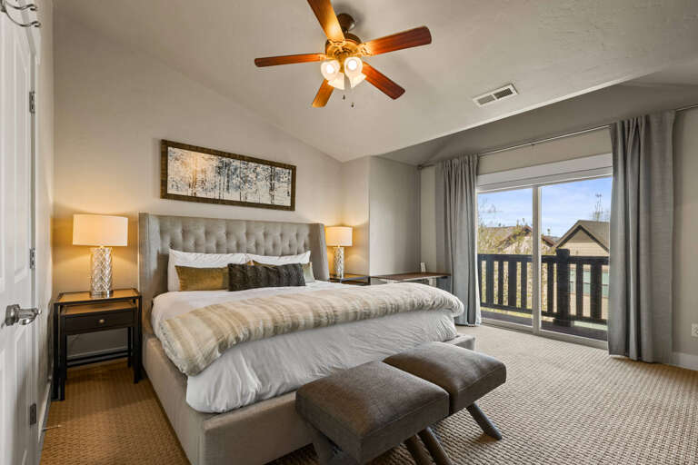 Sink into your plush king bed after a day of adventure, with soft lighting and mountain air flowing through your private balcony.