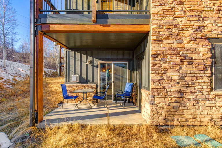 Covered patio with seating and clear views of the surrounding hillside, offering a sheltered spot to relax outdoors.