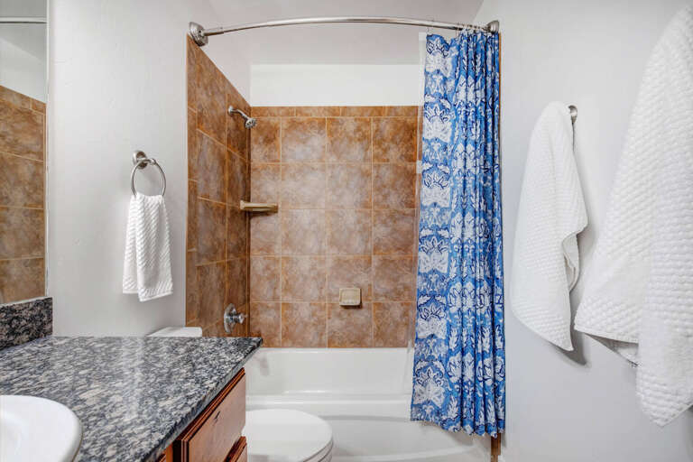 Refresh in your beautiful tiled bathroom with elegant granite countertops and a relaxing tub-shower combo.