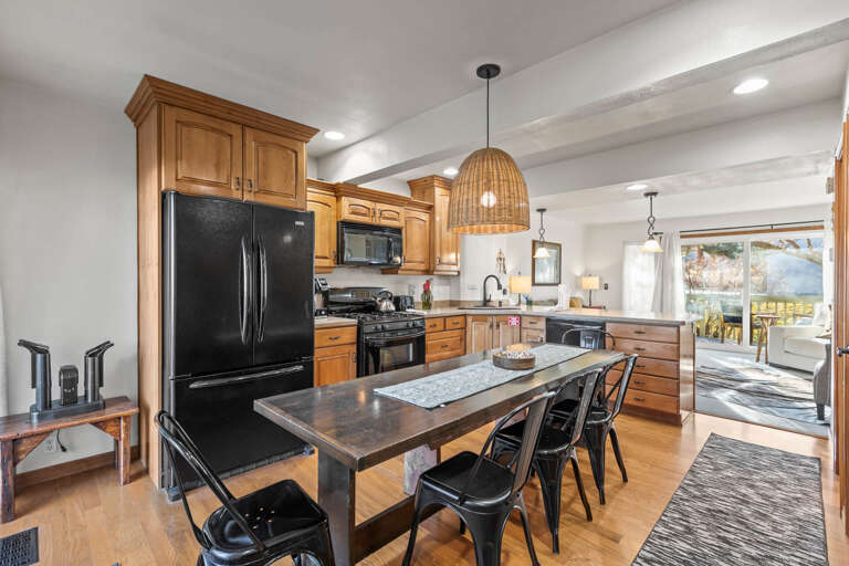 Your gourmet kitchen features granite counters, full appliances, and a spacious island where you'll create memorable meals together.