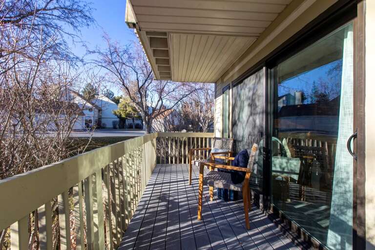 Step onto your private balcony where morning coffee tastes better in the fresh air and gentle shadows dance across the deck.