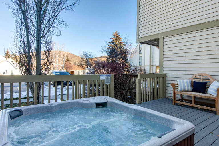 Soak in your private hot tub on the deck, surrounded by mountain views and winter serenity.
