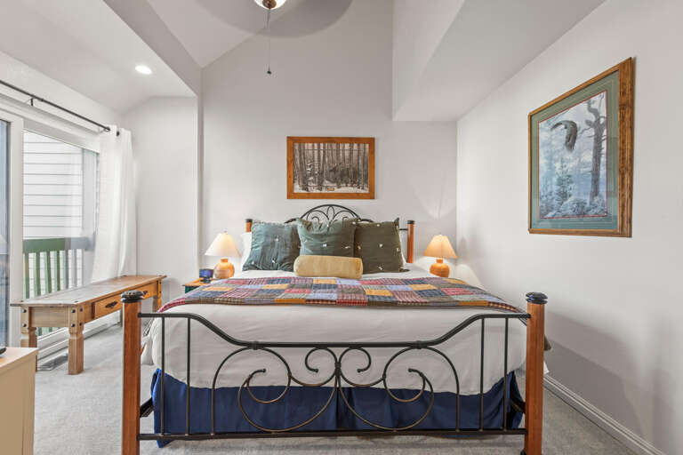 Unwind in your cozy bedroom featuring charming decor, soft lighting, and peaceful artwork that creates the perfect mountain retreat ambiance.