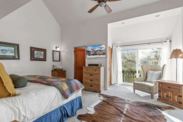 Wake up to stunning mountain views in this cozy bedroom with rustic charm and modern comfort for your perfect retreat.