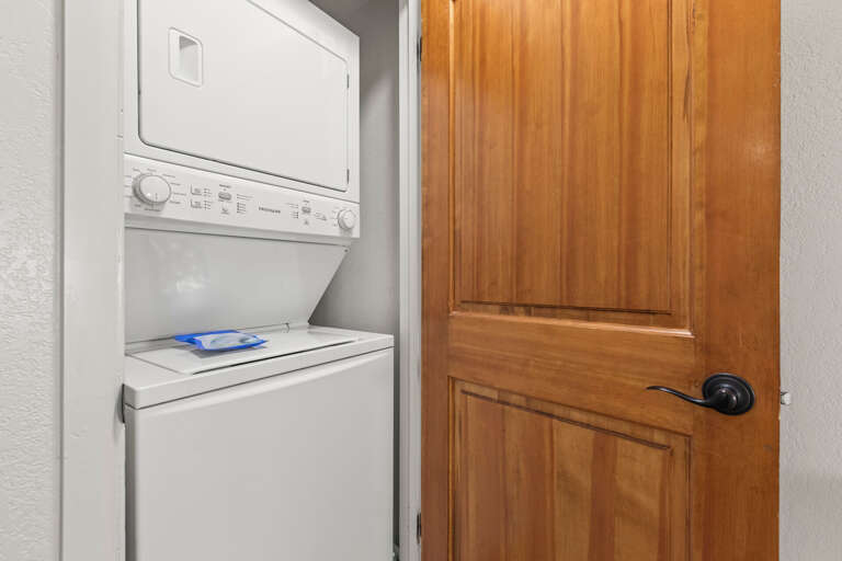 Your own washer and dryer make packing light a breeze, tucked away behind elegant wood doors for a seamless stay.