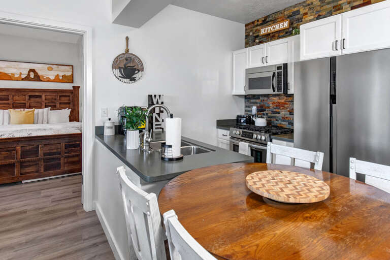 Your fully equipped kitchen features stainless steel appliances and granite counters, perfect for preparing meals together.