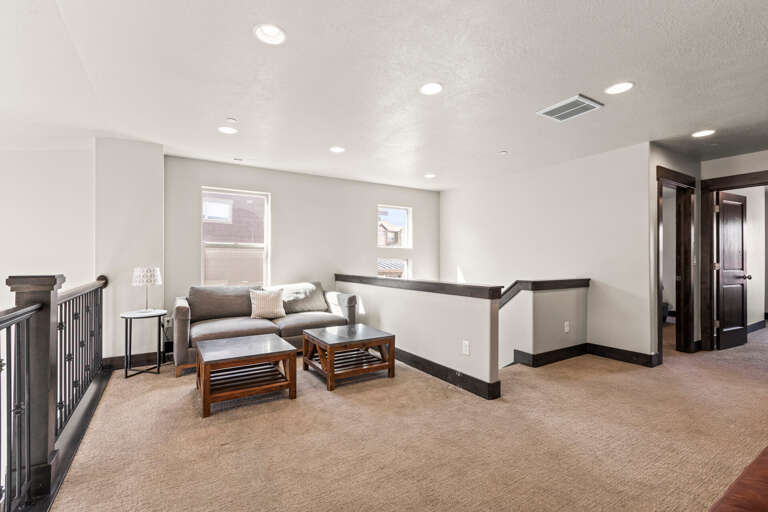 Relax in your private upstairs lounge with plush seating and natural light streaming through windows.