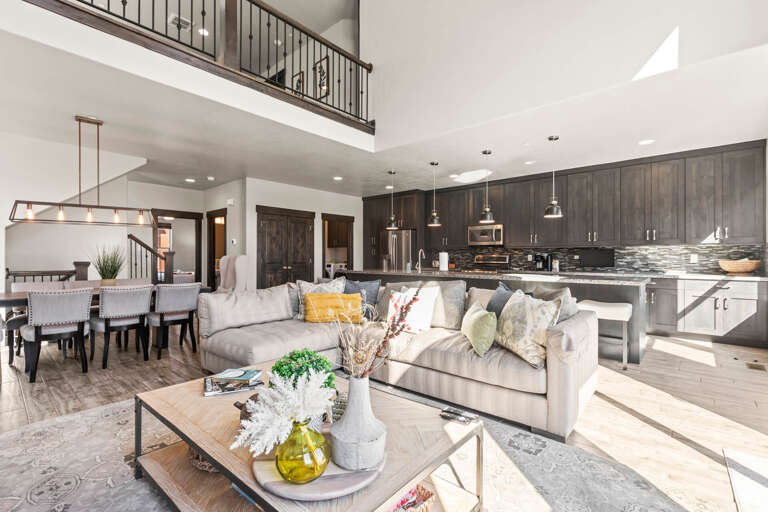 Relax in your spacious open-concept haven where modern comfort meets rustic charm, featuring soaring ceilings and thoughtful design throughout.