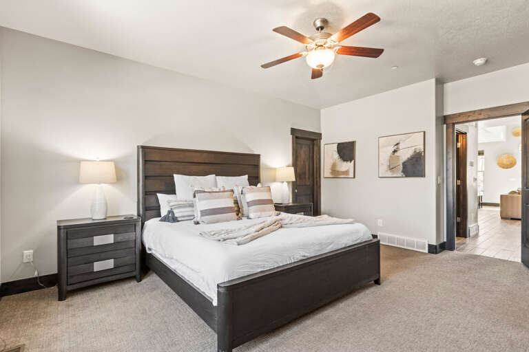 Your spacious bedroom features a comfortable king bed, elegant furnishings, and soft lighting for the perfect night's rest.