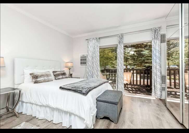 Wake up refreshed in your airy bedroom, where natural light filters through elegant curtains and sliding doors open to your private balcony retreat.