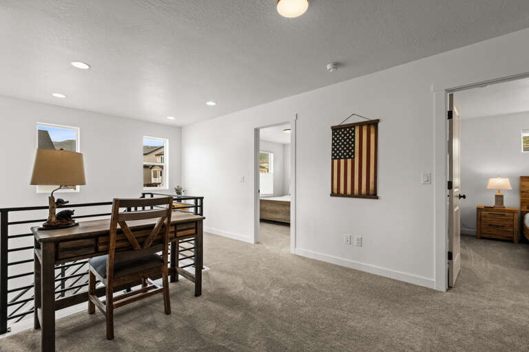 Your bright upstairs workspace offers a quiet desk area with views, plus easy access to bedrooms for a productive stay.