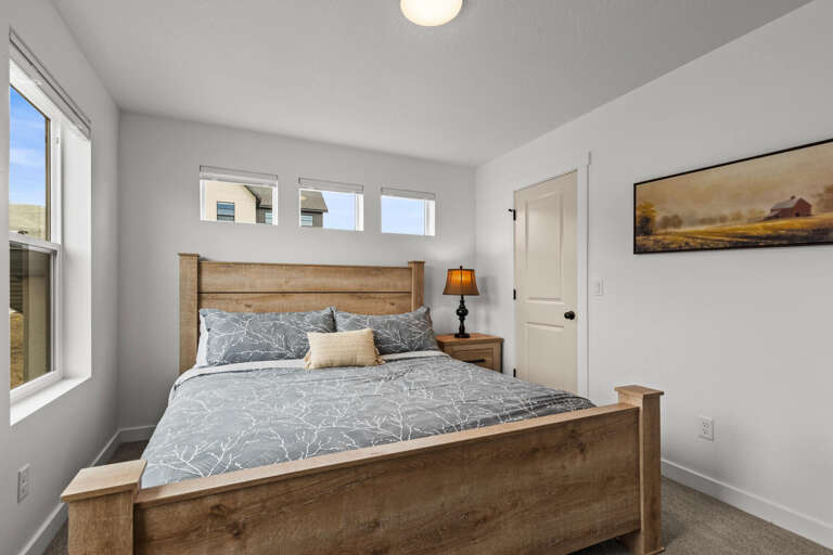 Drift off in your peaceful bedroom, where rustic wood meets modern comfort and soft natural light fills the space.