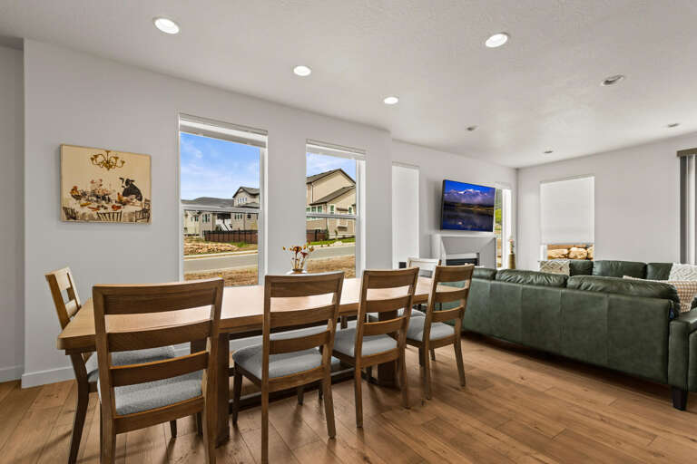 Gather around your spacious dining table for memorable meals, then sink into the plush sofa to unwind while natural light streams through large windows.