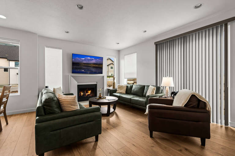Sink into plush seating around your cozy fireplace while your favorite shows play on the large TV.