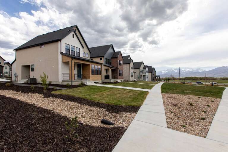 Modern vacation rental community set against stunning mountain views, offering convenient access and contemporary comfort in a peaceful neighborhood.