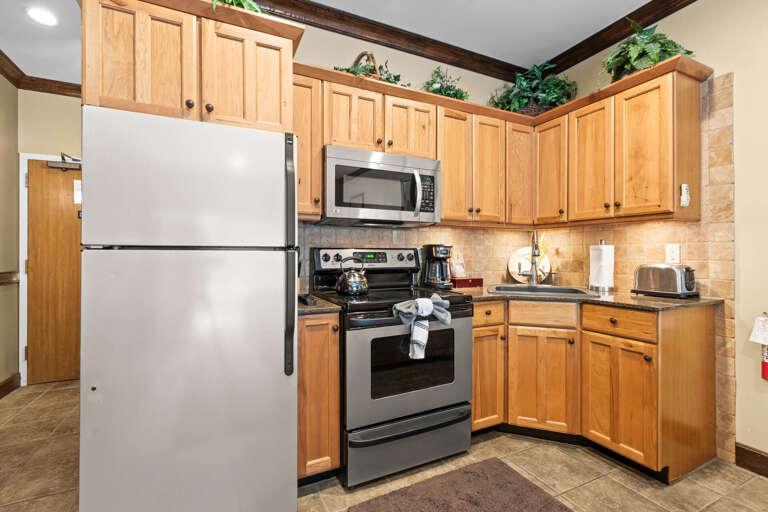 Your fully equipped kitchen features warm oak cabinetry, stainless appliances, and everything you need to prepare meals during your stayâincluding a coffee maker to start your mornings right.