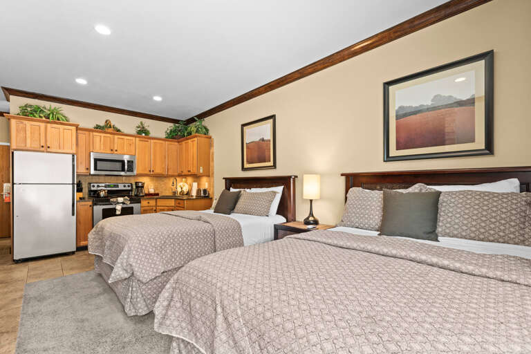 Your spacious suite combines comfort and convenience with two plush beds, a full kitchen, and thoughtful decorâeverything you need for a restful, memorable stay.