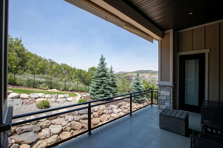 Step outside to your private covered terrace, where sweeping views of evergreens, rolling hills, and serene natural landscape surround youâa peaceful retreat awaits.