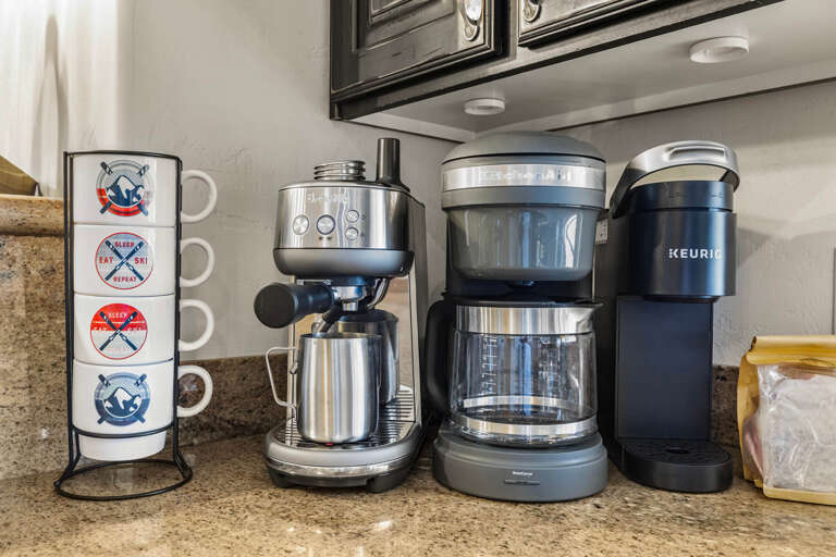 Your morning coffee station is ready with an espresso maker, drip machine, and Keurigâthree ways to brew your perfect cup.