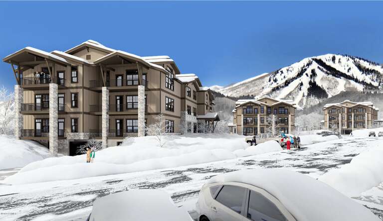 Multi-building resort complex nestled at the base of a snow-covered mountain, offering ski-in access and alpine village charm.