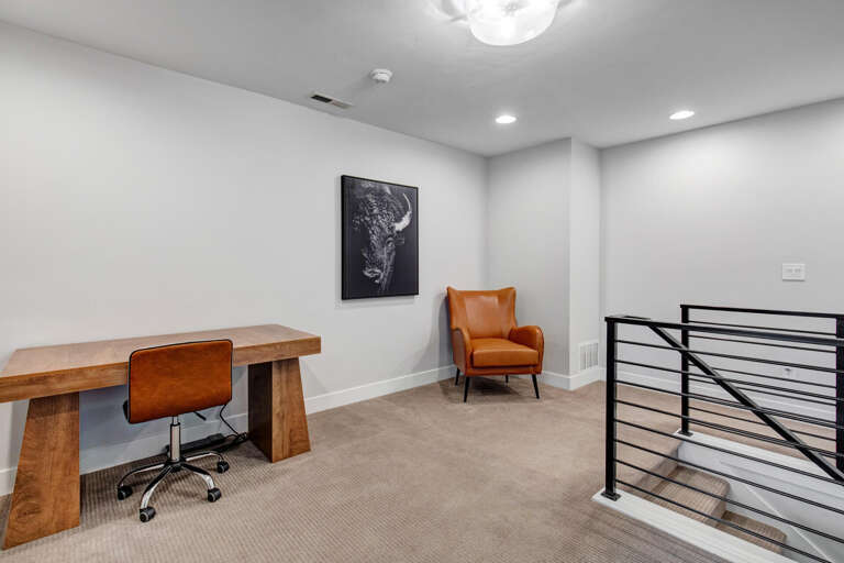 Step into your own quiet corner for work or reflection, with a sleek desk, comfortable seating, and stylish modern touches that help you focus and unwind.