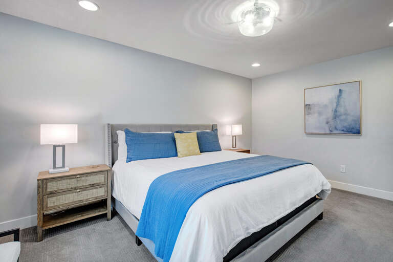 Unwind in your tranquil bedroom with crisp linens and calming coastal tones that invite deep, restful sleep after your day of adventure.