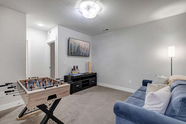 Challenge friends to foosball or relax with board games in your private entertainment space. The comfortable seating and welcoming atmosphere make this the perfect spot for family fun and friendly competition.