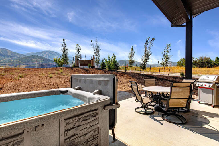 Unwind in your private hot tub while mountain views stretch across the horizon, or fire up the grill and dine al fresco on the covered patioâyour perfect outdoor retreat awaits.