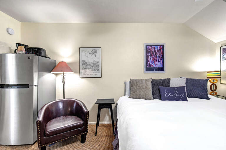 Your cozy retreat blends comfort with convenienceâsink into crisp linens after exploring or whip up a snack in your mini fridge corner.