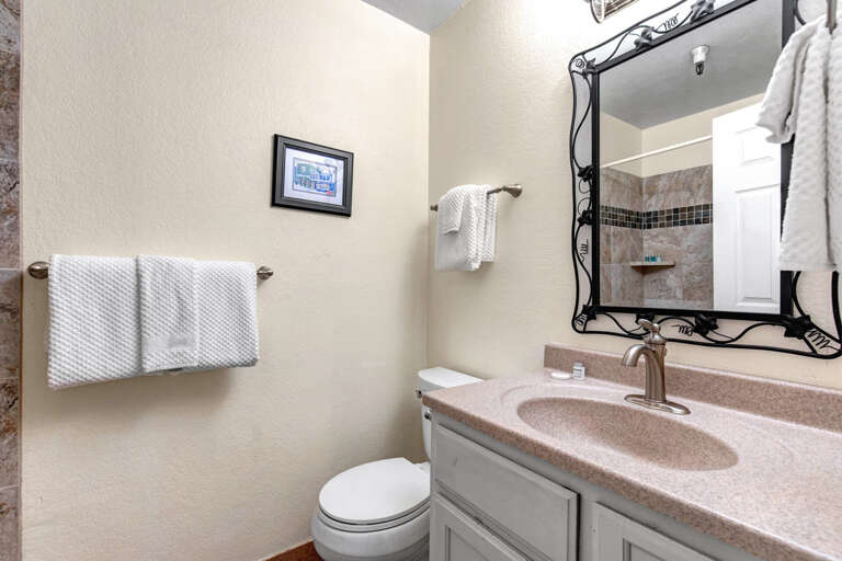 Freshen up in your private bathroom with a large vanity, soft towels, and a walk-in showerâeverything you need for a comfortable stay.