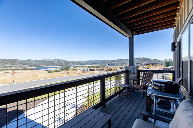 Step onto your private balcony and take in sweeping views of rolling hills, distant water, and open skies—a perfect spot to unwind with morning coffee or watch the day unfold.