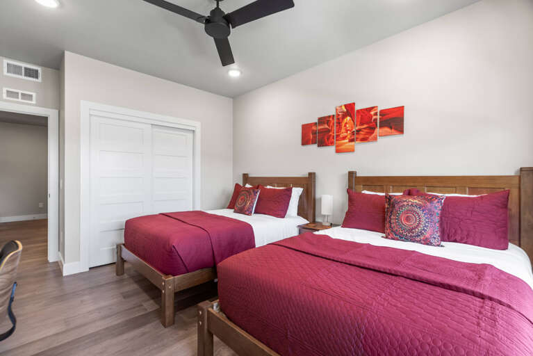 Sink into plush bedding in your peaceful twin bedroom, where rich tones and modern comfort set the stage for restful nights and easy mornings.