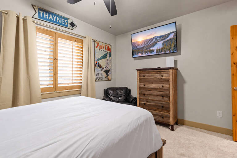 Drift off in this cozy bedroom, complete with a plush bed, vintage ski charm, and all the space you need to unwind after a day of adventure.