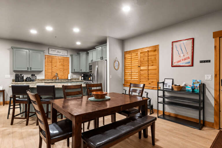 Gather around the dining table and share stories while your group prepares meals together in the spacious, fully-equipped kitchen just steps away.