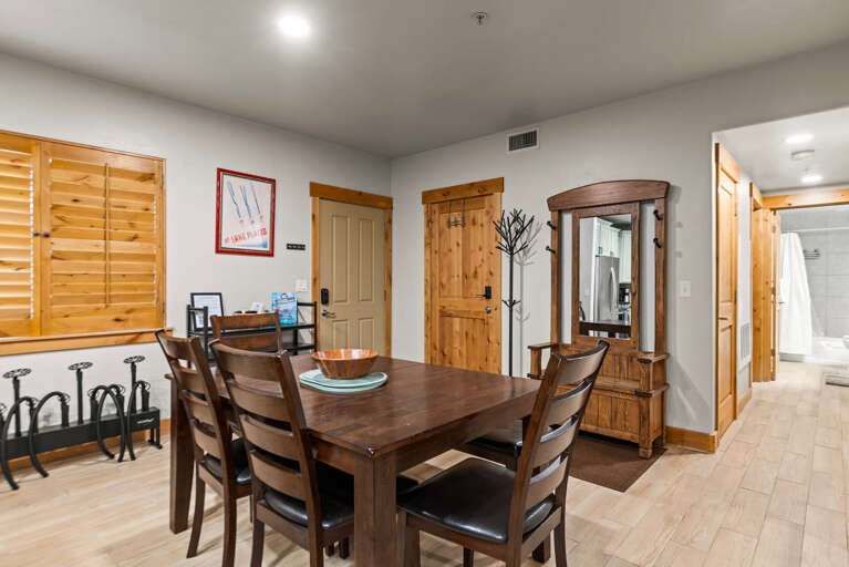Gather around this inviting dining table where your group can share meals and stories. Warm wood accents and an open layout create a welcoming space that flows naturally into the rest of your retreat.