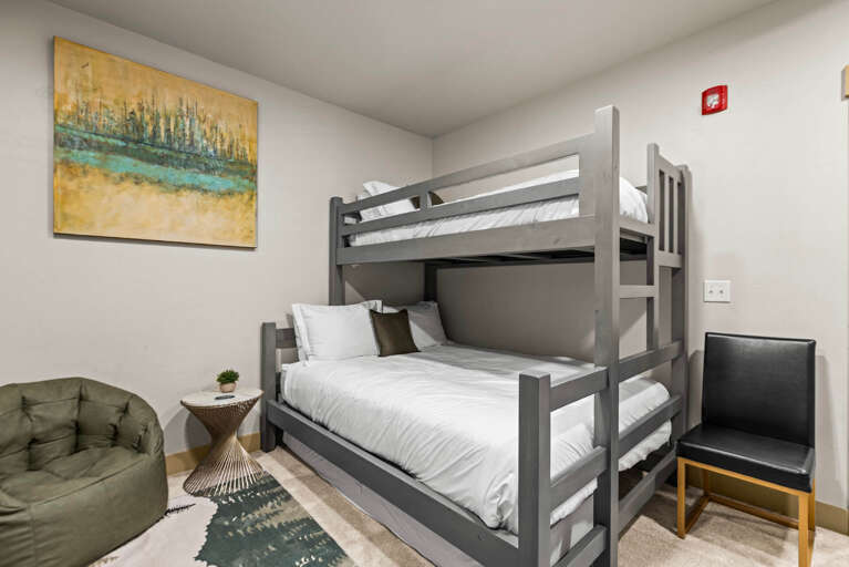 Your kids will love bunking down here after a day of adventure, with crisp linens and a cozy chair nearby for bedtime stories.