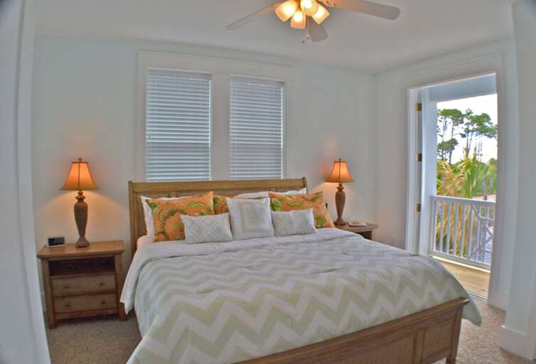 2nd Floor King bedroom with private deck overlooking the lake.