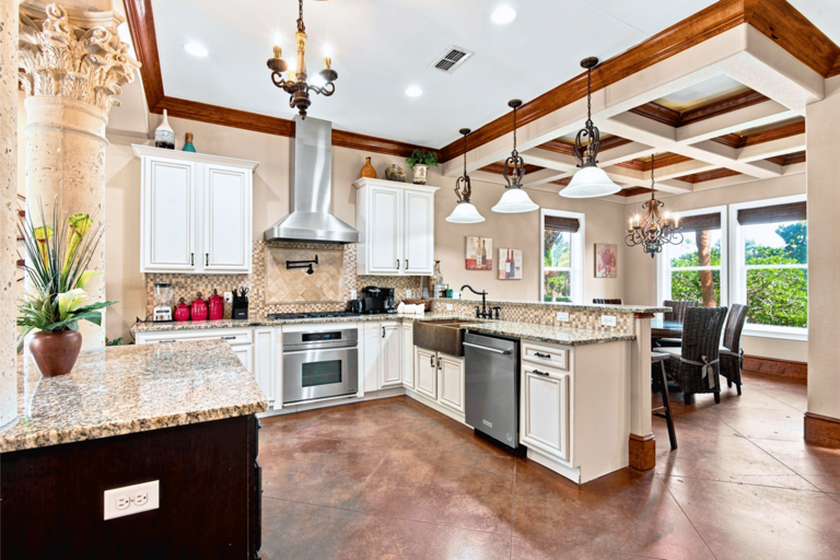 1st Floor - 🍽️ Gourmet Kitchen: Granite counters, premium appliances, and custom copper sinks